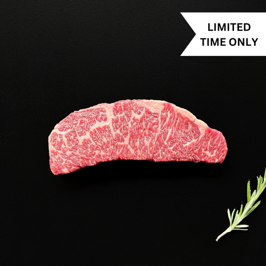 Wagyu Denver steak with marbling on black background with rosemary sprig. Banner reads 'LIMITED TIME ONLY'
